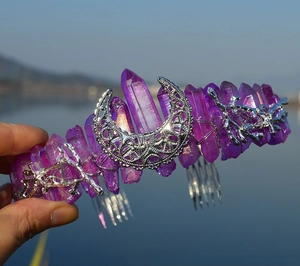 Close-up of handmade purple crystal cat ear crown with silver moon and twig details