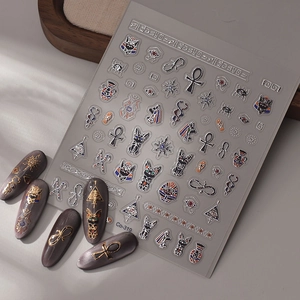 Detailed relief stickers featuring Egyptian symbols like Horus Eye and Ankh on gray matte nails