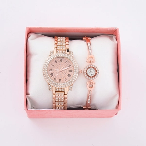 Rose gold watch and bracelet set with rhinestones in a pink jewelry gift box