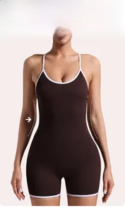 Detailed view of dark brown ribbed yoga bodysuit with white contrast trim and shaping design