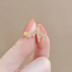 Elegant gold heart and heartbeat bow brooch with shimmering small rhinestones