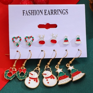 Detailed set of six Christmas earrings featuring snowmen, reindeer, and trees