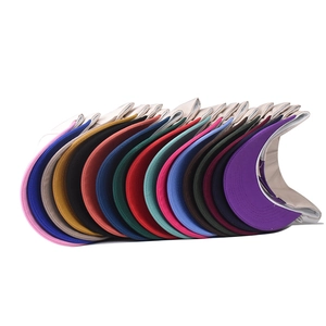 Detailed view of stackable baseball caps in multiple colors featuring a curved brim