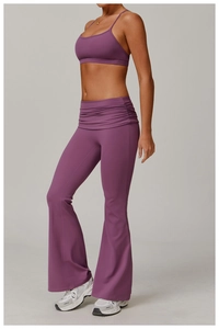 Detail of high-waisted flared yoga pants with gathered waist design in smoky purple
