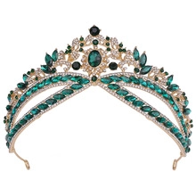 Macro shot of green crystal wheat ear wedding crown in baroque gold finish