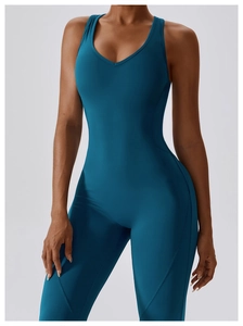 Detailed view of deep teal quick-dry yoga jumpsuit featuring V-neck and slim-fit design