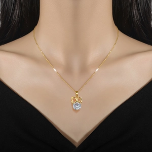 Elegant gold titanium steel necklace featuring a crystal heart pendant on model