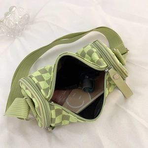 Light green checkered cylinder crossbody bag with wide strap and daily storage view