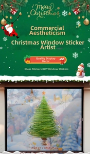 Detailed view of green coil Christmas tree window stickers on a glass storefront pane