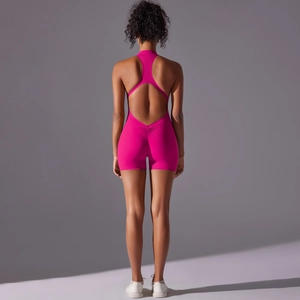Detailed back view of pink racerback yoga bodysuit featuring scrunch butt lifting texture