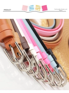 Detailed close-up of colorful thin leather belts with silver alloy pin buckles