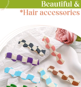 Detail showing wave-shaped checkerboard hair clips in multiple candy color combinations