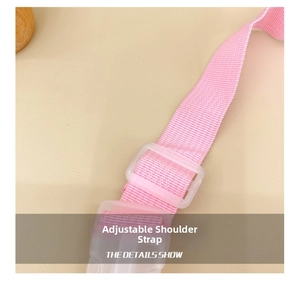 Close-up of pink adjustable woven fiber shoulder strap with durable white plastic buckle