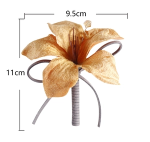 Detailed view of handmade fabric lily boutonniere with champagne petals and gray ribbon