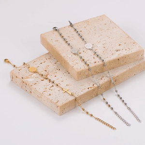 Religious stainless steel rosary bracelets with cross and saint medal charms in three finishes