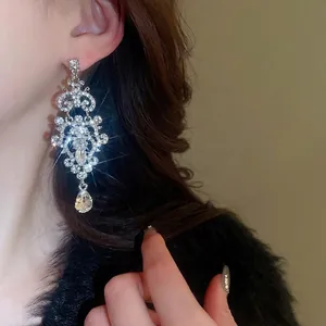 Bohemian style drop earrings with sparkling crystals and a large teardrop pendant