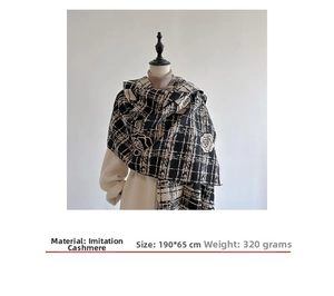 Macro shot of 190x65cm imitation cashmere shawl with elegant black and white rose patterns