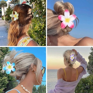 Collage of four floral plumeria hair claws in yellow, pink, blue and purple gradients