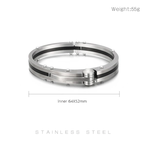 Detail of industrial stainless steel bracelet with black carbon fiber and rivet accents