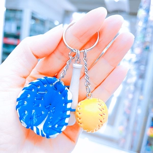 Close-up of a three-piece baseball keychain set with glove, bat, and ball charm