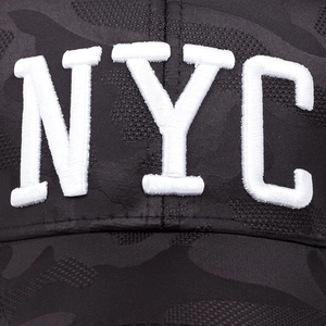 Camo baseball cap with 3D white NYC embroidery and durable woven texture detail