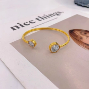 Minimalist gold-plated open cuff bracelet with pavé crystal discs and luxury finish