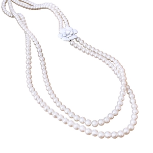 Double-layer glass pearl necklace featuring white camellia flower pendants in vintage style