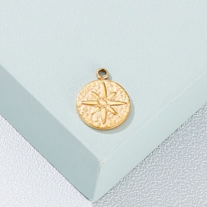 Golden stainless steel round pendant featuring a vintage embossed cross star pattern