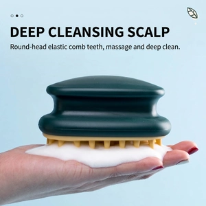 Silicone scalp massager shampoo brush in deep green with soft bristles and foam