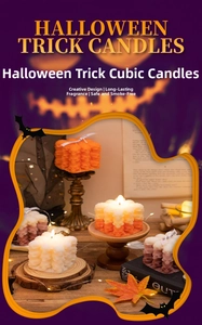 Macro detail of skeleton cube scented candles in orange and white with festive pumpkin decor