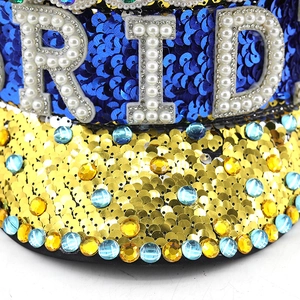 Macro detail of royal blue sequins and crystal rhinestones on a Bride party hat