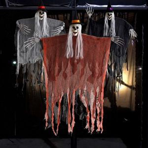 Three hanging Halloween skull ghosts in orange, grey, and black robes for party decor
