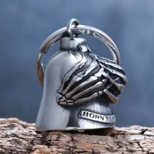 Detail of vintage motorcycle guardian bell with skull claw and 'Born to Be' engraving