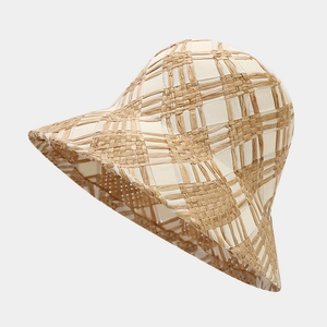 Cross-woven straw bucket hat in beige with grid texture for summer beach sun protection