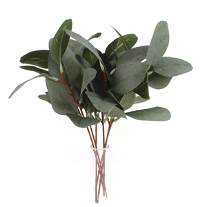 Close-up detail of artificial eucalyptus branches with green leaves and realistic berries