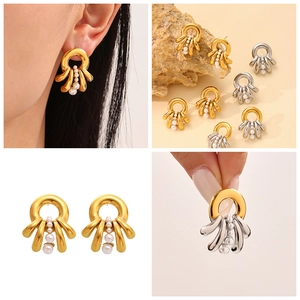 Detail shots of French multi-layer pearl tassel earrings in polished gold and silver finish