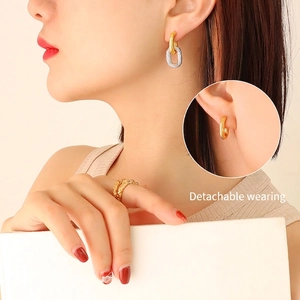 Two-tone detachable gold and silver twisted hoop earrings with matching ring