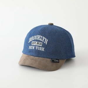 Close-up of denim crown and brown suede brim with Brooklyn embroidery detail