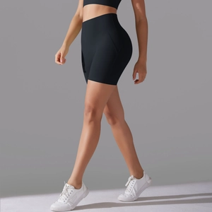 Detailed side view of high-waisted black yoga shorts showing compression and sleek fit