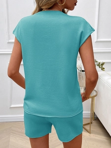 Women's two-piece teal summer set with sleeveless top and shorts shown from back view