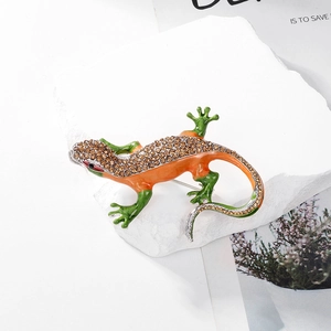 Exquisite lizard brooch with colorful diamonds on stone background for women fashion