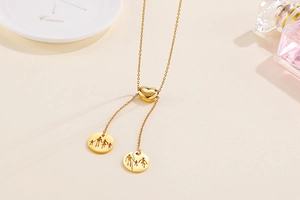 Detailed view of gold heart slider necklace featuring a family silhouette cutout pendant