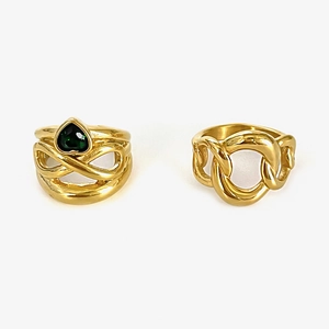 Gold stainless steel rings featuring a green heart stone and a chunky chain link design