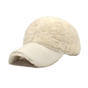 Detail view of cream plush baseball cap showing contrast between fleece and smooth brim