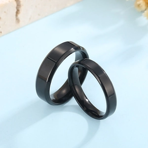 Polished black stainless steel couple rings set in minimalist 4mm and 6mm widths