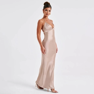 Detail of elegant deep V-neck and satin texture on backless champagne evening dress