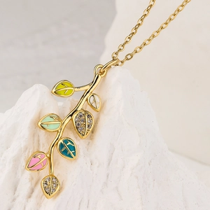 Elegant gold leaf pendant necklace with colorful enamel and sparkling zircon accents