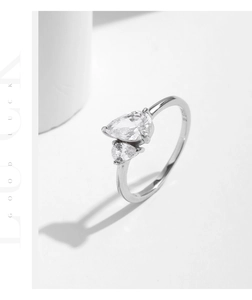 Close-up of S925 sterling silver interlaced ring with pear-cut cubic zirconia stones