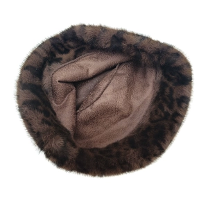 Detailed view of leopard print faux fur bucket hat with soft plush fleece lining