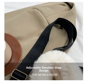 Detail of white fluffy tote bag showing the black adjustable nylon strap with metal buckle